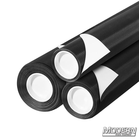 Rolls of Ultrabounce fabric with white and black surfaces, designed for lighting control in photography and film